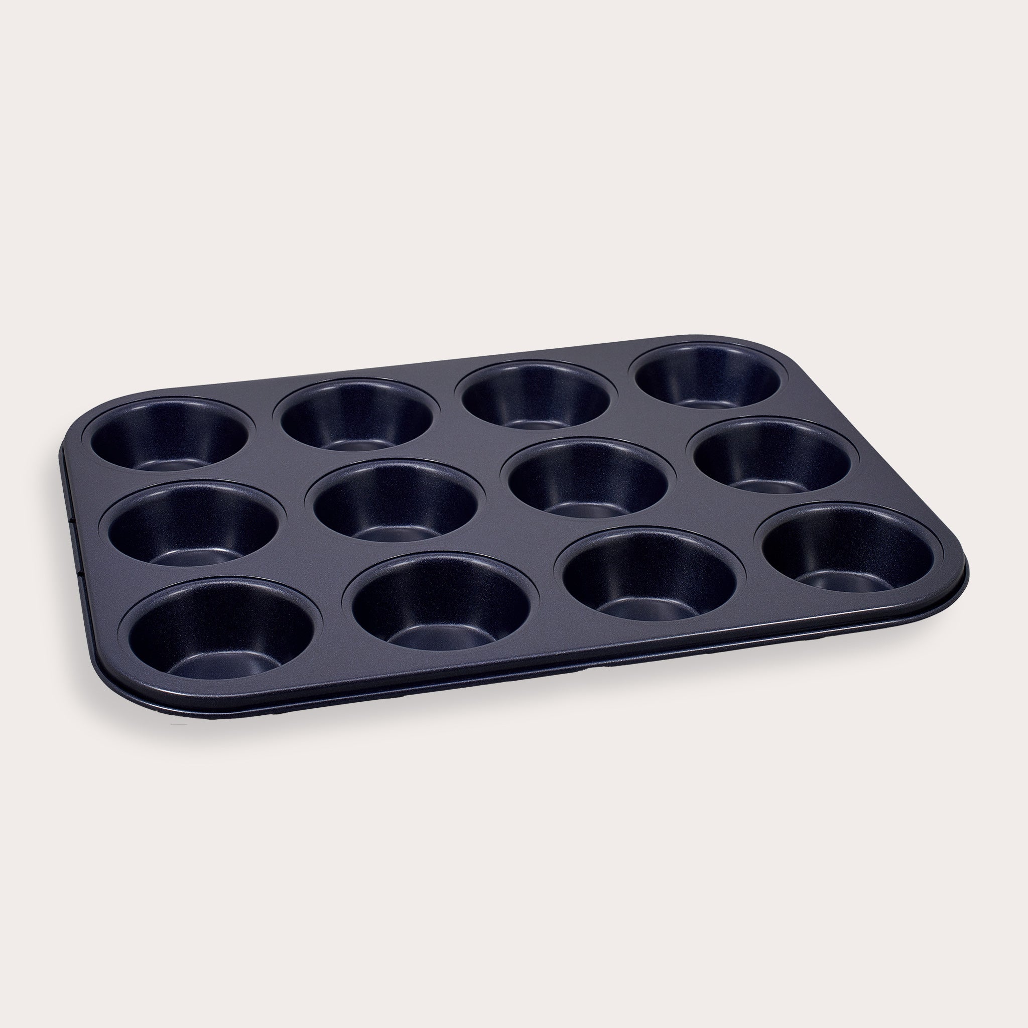 A Zyliss Durable Non-Stick 12 Hole Muffin Pan in black is displayed on a plain light background.