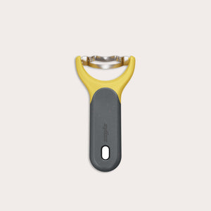 The Zyliss Corn Stripper, featuring a yellow and gray ergonomic handle and wide horizontal stainless steel blade for easy kernel removal, is shown on a plain white background. 