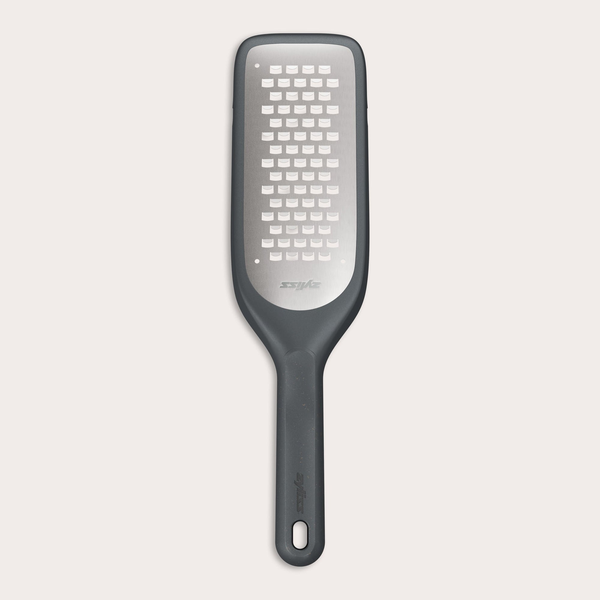 The Zyliss Coarse Grater is a black and silver foot file with a long handle and ultra-sharp grater surface, designed to efficiently remove dead skin from feet. 