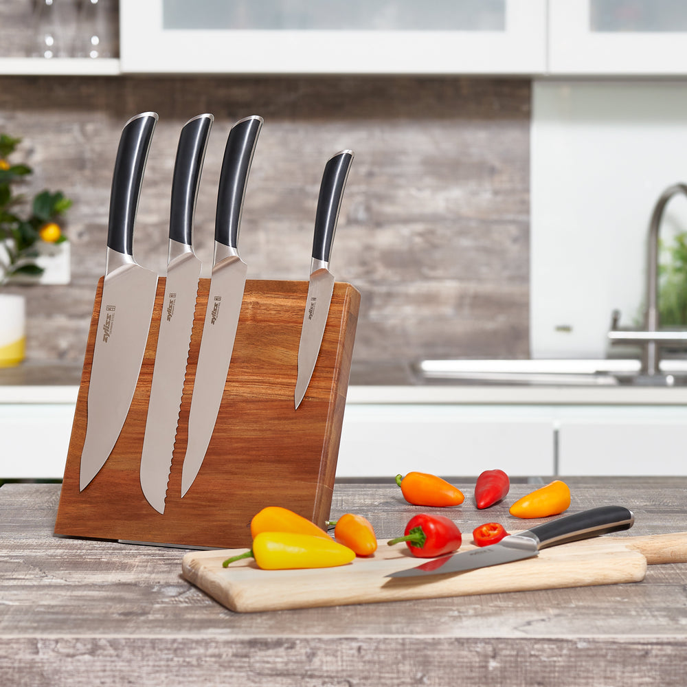 The Zyliss Comfort Pro Magnetic Knife Block features a simple, angled rectangular wooden design with a metal base, offering space-saving and stylish kitchen knife storage, shown against a plain white background. 