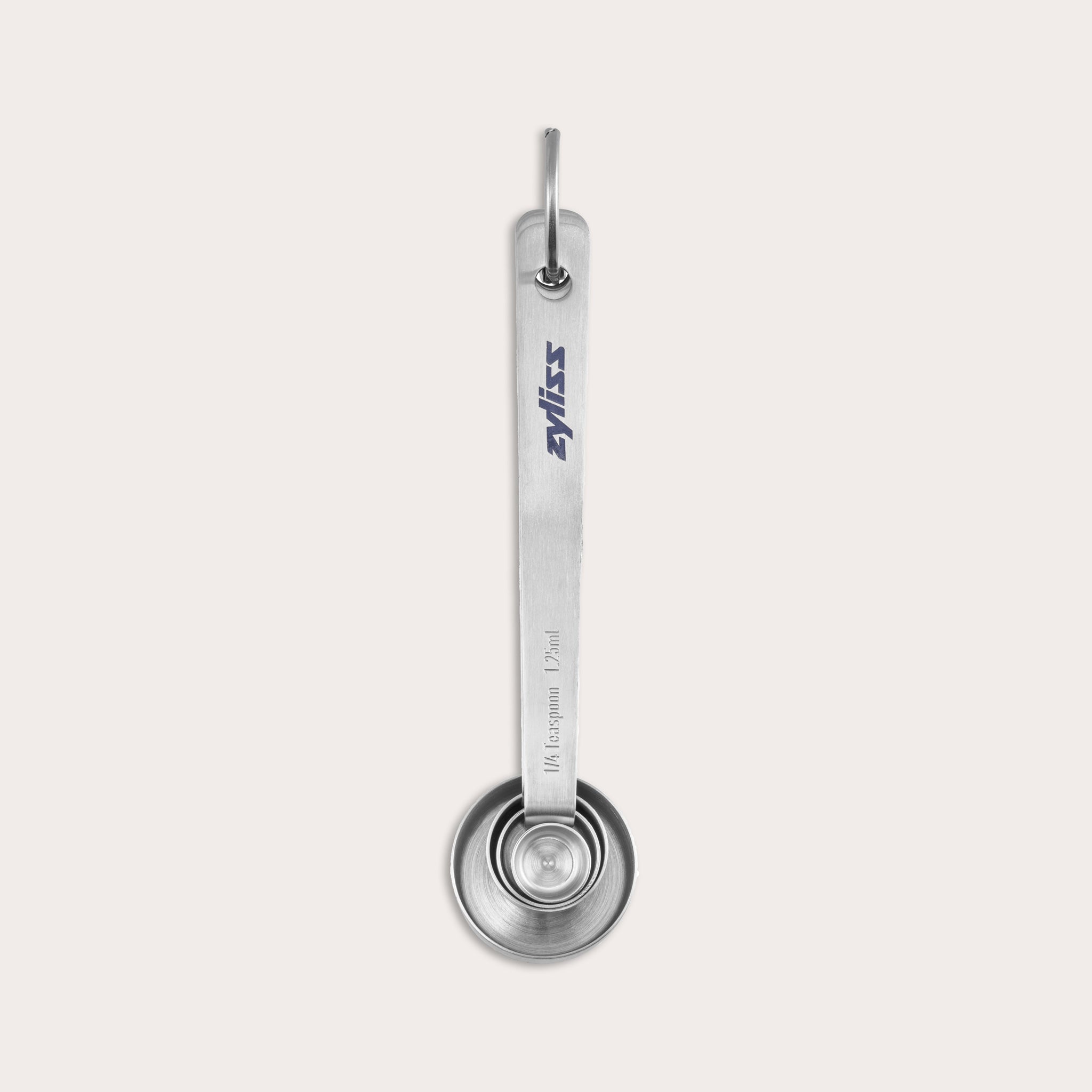A metal tablespoon measuring spoon with the brand name SILVIS printed on the handle, shown from above against a white background. The spoon is held together with a metal ring.