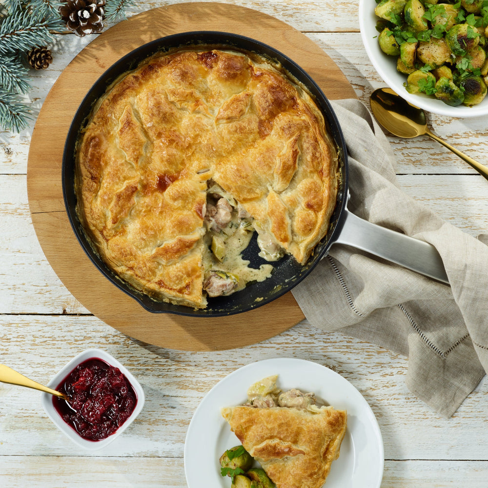The Zyliss Ultimate Pro Non-Stick Frying Pan With Pouring Lip features a black, Swiss-coated hard-anodized aluminum body and a long gray handle, shown on a plain white background. #20cm/8"