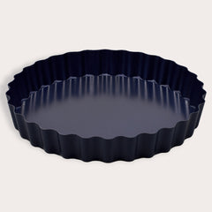 The Zyliss Durable Non-Stick Tart Pan, made from strong carbon steel with fluted edges and a non-stick coating, is shown on a plain light background—ideal for baking tarts or quiches.