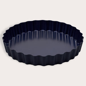 The Zyliss Durable Non-Stick Tart Pan, made from strong carbon steel with fluted edges and a non-stick coating, is shown on a plain light background—ideal for baking tarts or quiches.