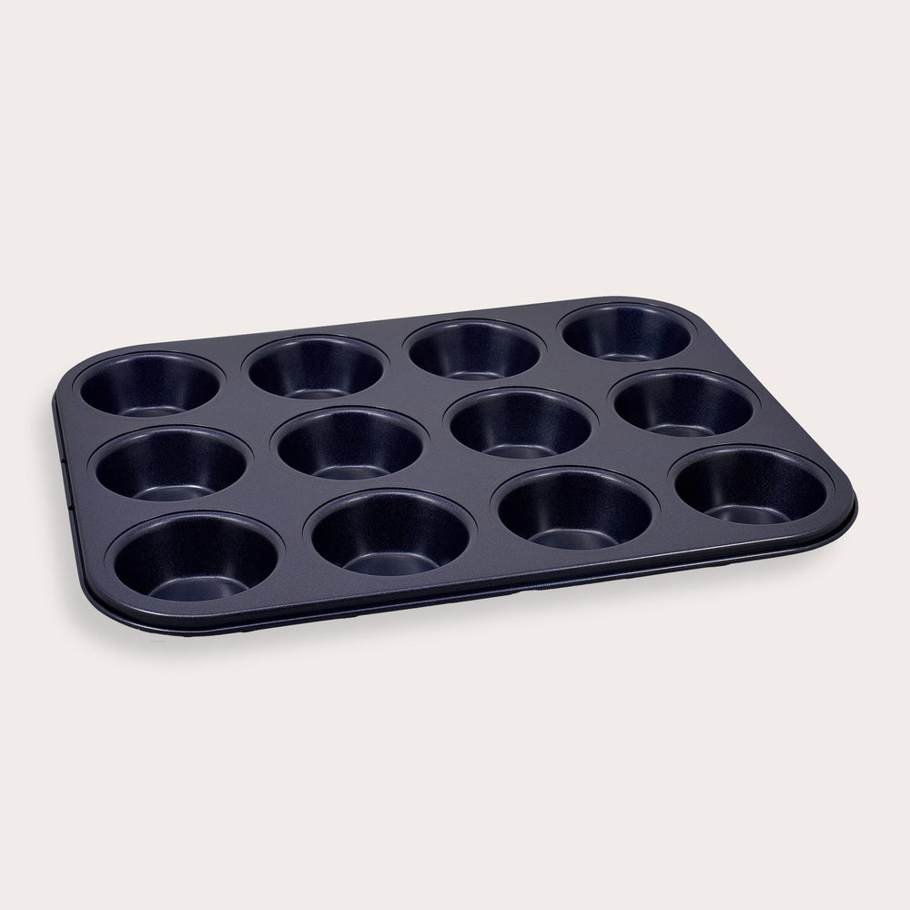 A Zyliss Durable Non-Stick 12 Hole Muffin Pan in black is displayed on a plain light background.