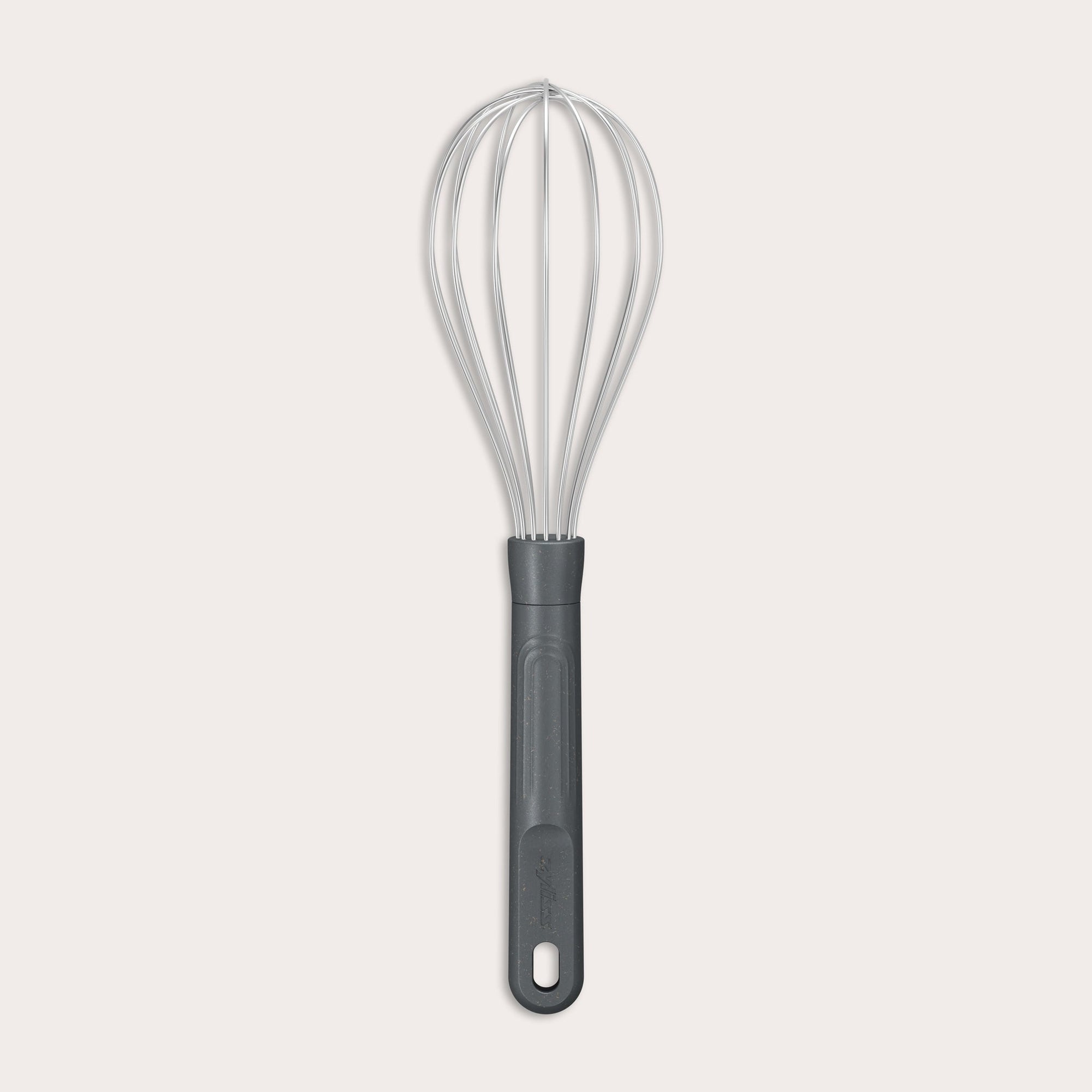 The Zyliss Balloon Whisk features a metal balloon with a black plastic handle and a heat-resistant silicone coating safe for non-stick cookware. The handle includes a hole at the end for easy hanging. Shown against a plain light background. #Medium