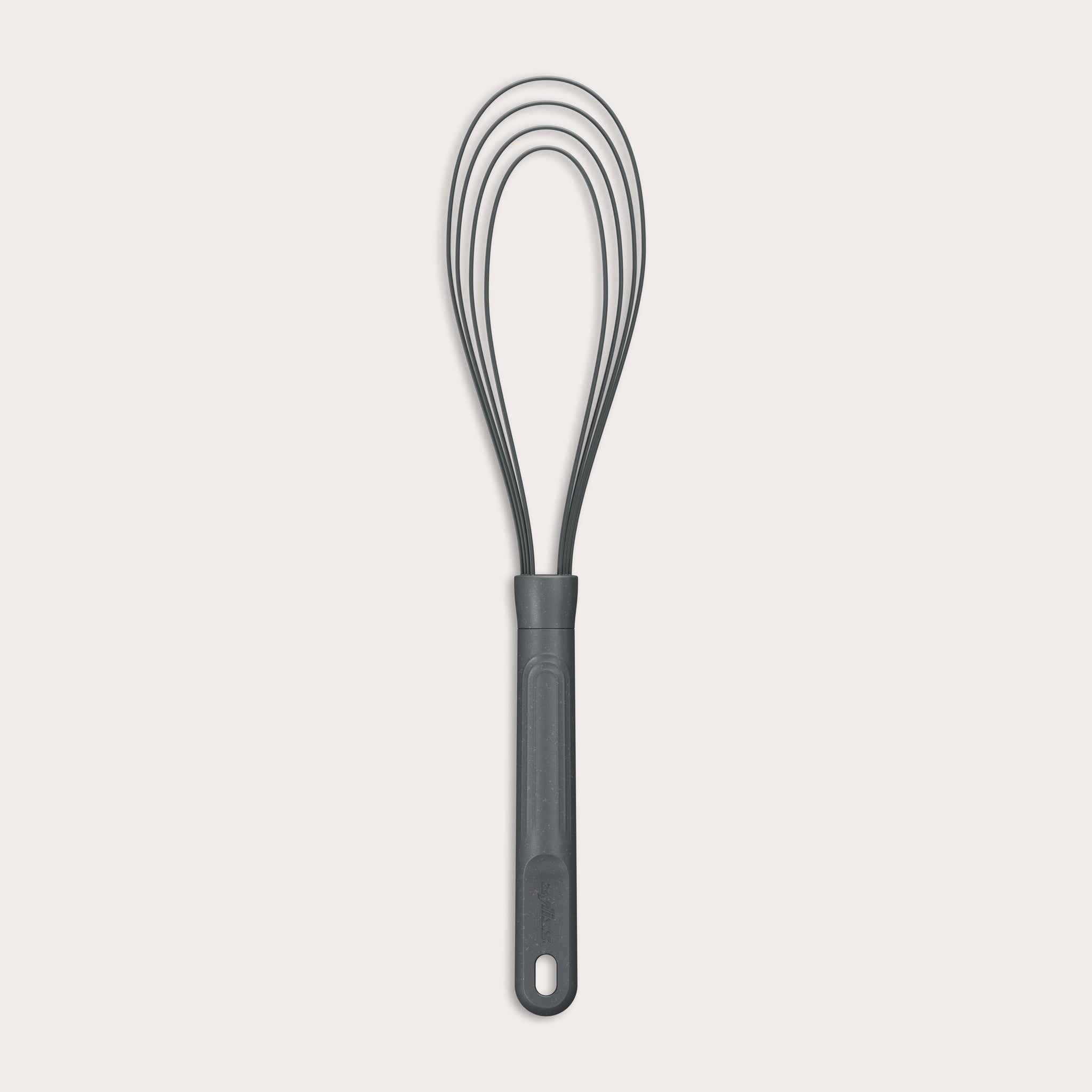 The Zyliss Flat Whisk Silicone features a black, heat-resistant silicone design with a long handle and looped wires, displayed on a plain light background. 
