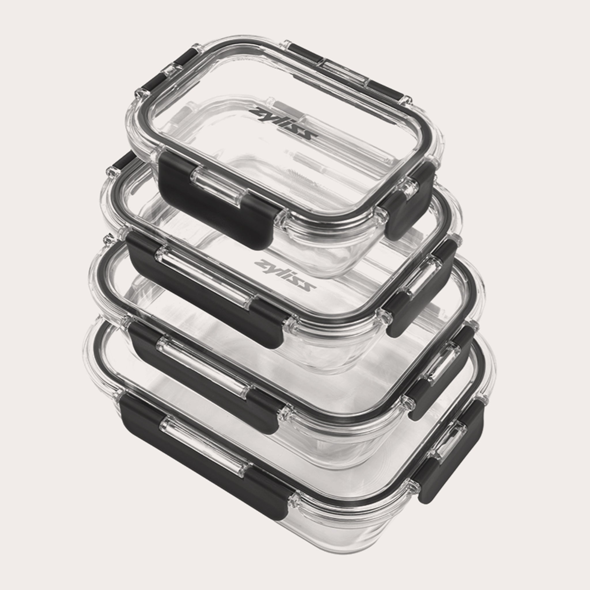 The Zyliss 4-Piece Glass Container Set features clear borosilicate containers with black locking lids, stacked neatly for leak-proof food storage against a plain white background.