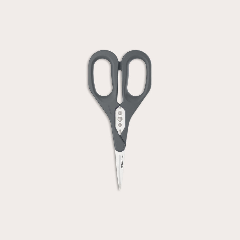 The Zyliss Herb Snippers feature dark gray handles and stainless steel blades, displayed against a plain light background.