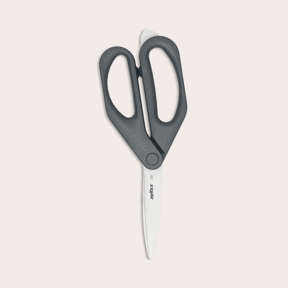 A pair of Zyliss Household Scissors with eco-friendly black handles and stainless steel blades shown against a plain light background.
