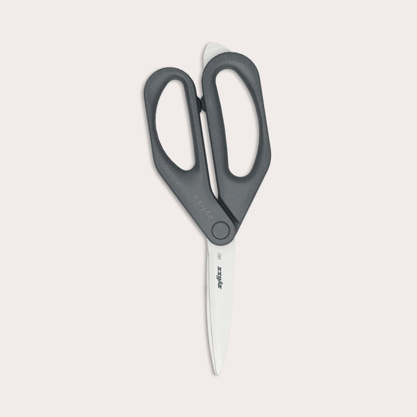 A pair of Zyliss Household Scissors with eco-friendly black handles and stainless steel blades shown against a plain light background.