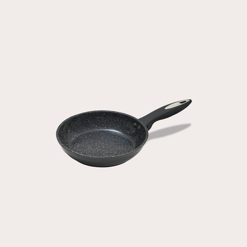 #20cm/8"
The Zyliss Ultimate Ceramic Fry Pan is shown with a black, speckled non-stick interior and long handle on a white background. This PFAS-free cookware is stylish and safe for daily use.