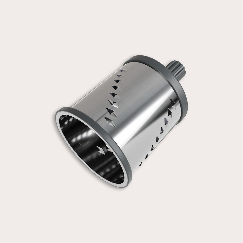 The Zyliss Julienne Drum Gourmet is a metal cylindrical tool with sharp stainless steel blades and a plastic gear attachment, shown against a plain light background. 